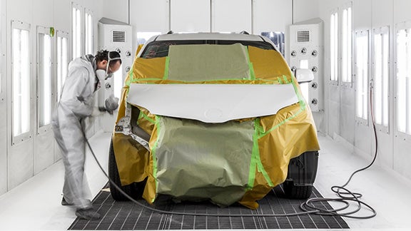 Collision Center Technician Painting a Vehicle | Longo Toyota of Prosper in Prosper TX