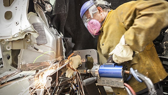 Collision Center Technician Repairing Vehicle | Longo Toyota of Prosper in Prosper TX